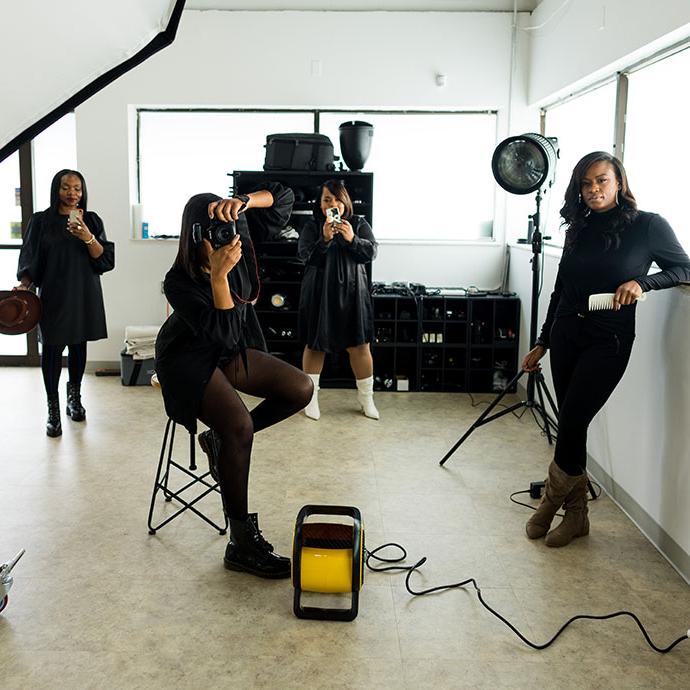 Four women looking at camera